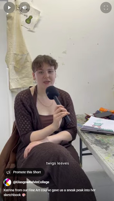 Fine Art student Katrina sharing pages from her sketchbook during an interview in the studio at Glasgow Kelvin College.