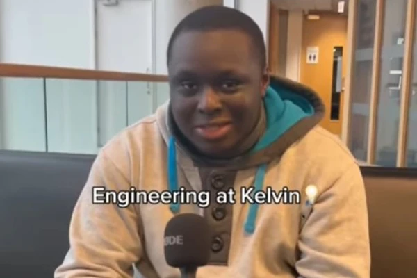 A student in a grey and teal hoodie sitting on a black sofa, holding a microphone and smiling. The text overlay reads 'Engineering at Kelvin 💡' with the student introducing themselves as studying HNC Mechanical Engineering at Glasgow Kelvin College. A student in a grey and teal hoodie sitting on a black sofa, holding a microphone and smiling. The text overlay reads 'Engineering at Kelvin 💡' with the student introducing themselves as studying HNC Mechanical Engineering at Glasgow Kelvin College.