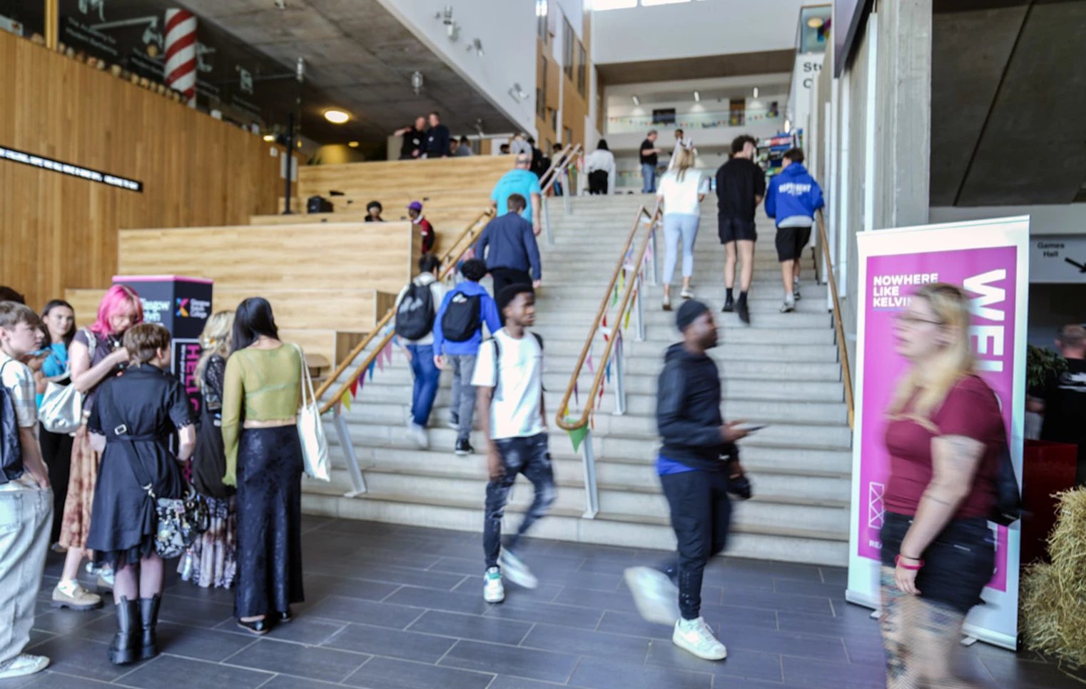 Students walking up the central staircase at Glasgow Kelvin College Springburn campus during a busy Open Day event Students walking up the central staircase at Glasgow Kelvin College Springburn campus during a busy Open Day event
