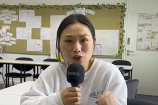 Tingting, a former Childcare with ESOL student at Glasgow Kelvin College, sits in a classroom holding a microphone and sharing her experience on the course. Tingting, a former Childcare with ESOL student at Glasgow Kelvin College, sits in a classroom holding a microphone and sharing her experience on the course.