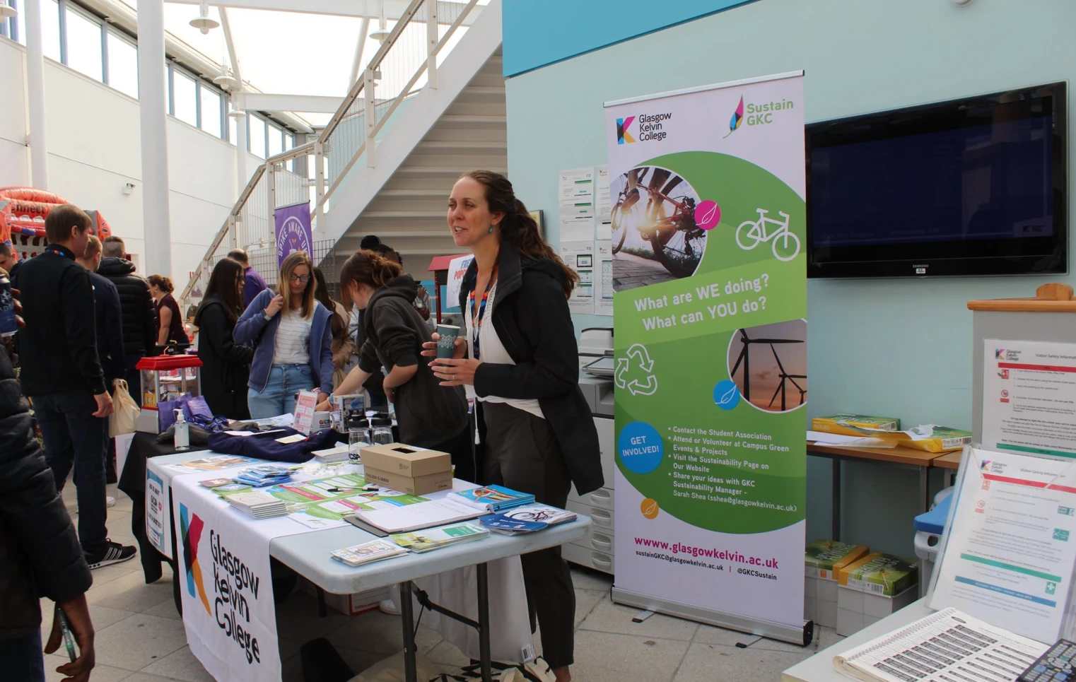 Glasgow Kelvin College sustainability stall at Freshers’ Week, featuring a banner, leaflets, and staff engaging with students about green initiatives. Glasgow Kelvin College sustainability stall at Freshers’ Week, featuring a banner, leaflets, and staff engaging with students about green initiatives.