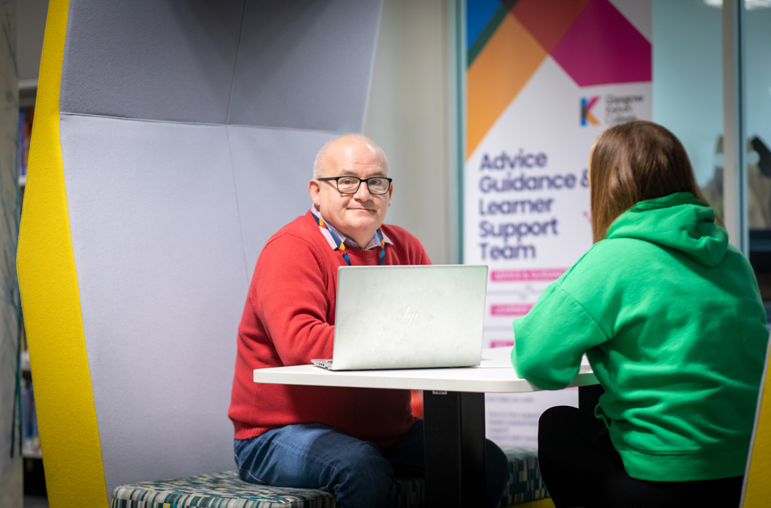 Advice and Guidance team member meeting with a student in a study pod at Glasgow Kelvin College’s Springburn campus.