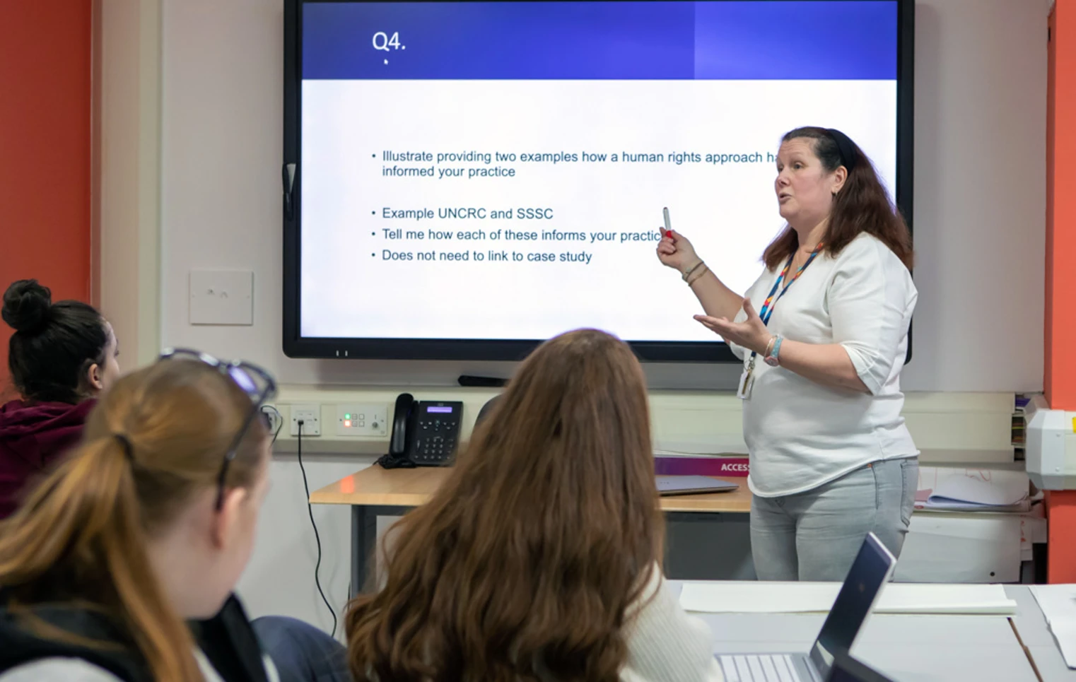 A lecturer at Glasgow Kelvin College leading an engaging discussion with students, exploring human rights approaches in practice. A lecturer at Glasgow Kelvin College leading an engaging discussion with students, exploring human rights approaches in practice.