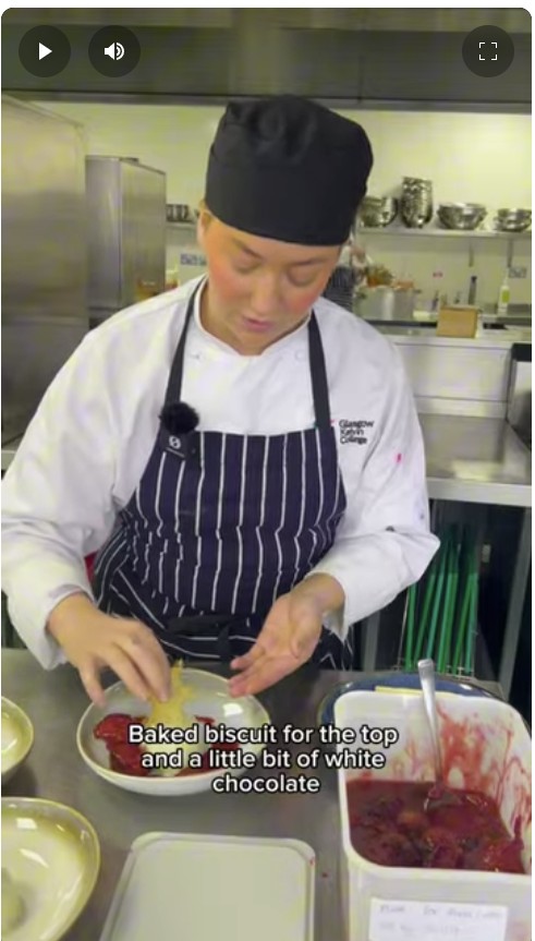 Hospitality student at Glasgow Kelvin College preparing a dessert in the kitchen during a practical cooking session.