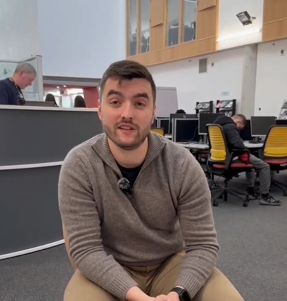 Access to Medicine student Alexander speaking during an interview in the library at Glasgow Kelvin College.
