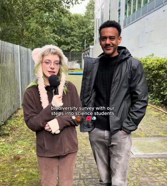 Steps into Science students taking part in a biodiversity survey on campus, collecting and discussing environmental data.