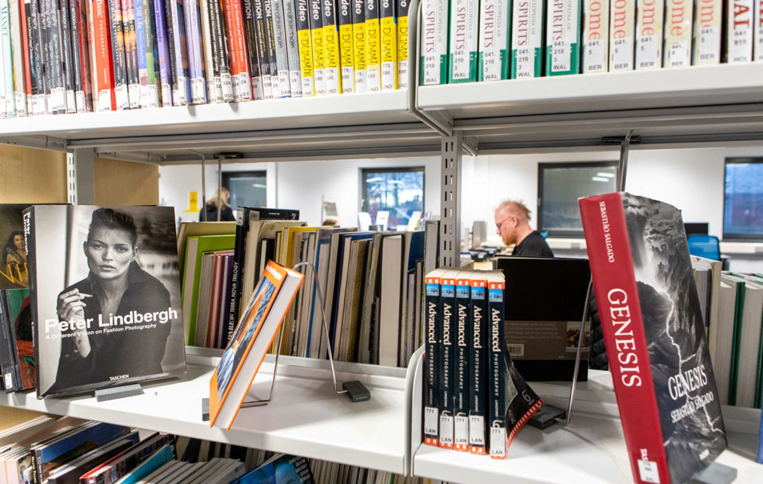 Books on display in the Easterhouse Campus library at Glasgow Kelvin College, with a student working in the background. Books on display in the Easterhouse Campus library at Glasgow Kelvin College, with a student working in the background.