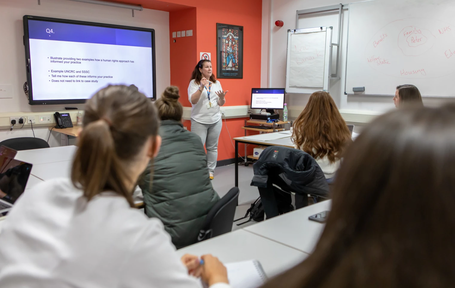 Glasgow Kelvin College students actively participating in class, guided by their lecturer through interactive discussions and activities. Glasgow Kelvin College students actively participating in class, guided by their lecturer through interactive discussions and activities.