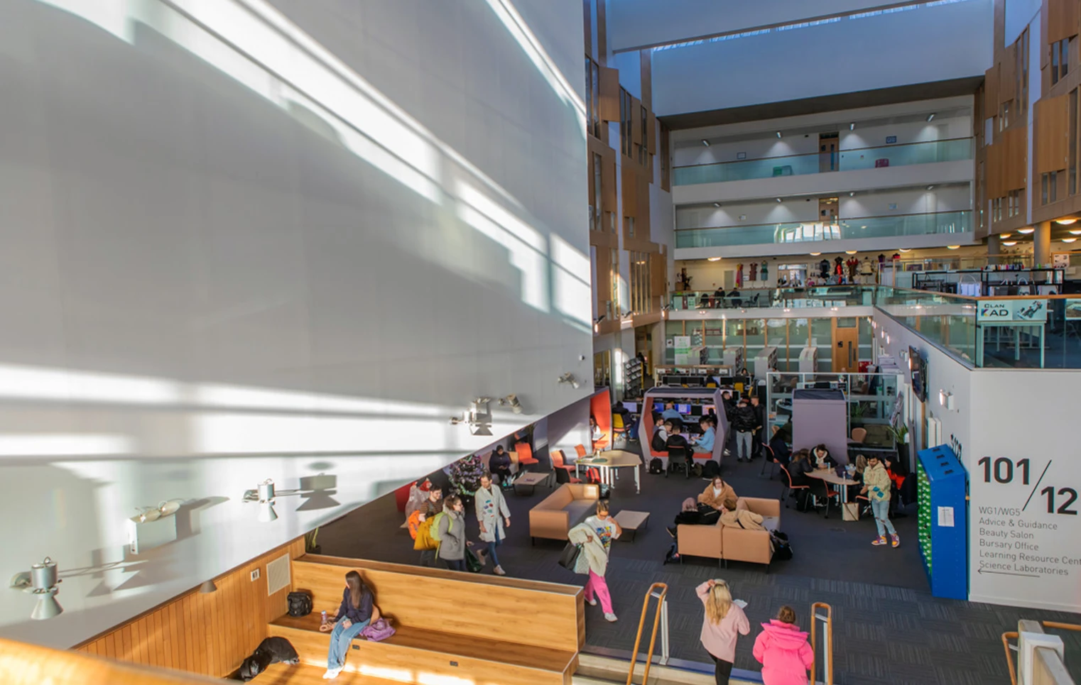 Bright, multi-level interior of Glasgow Kelvin College’s Springburn Campus, showing students studying and socialising in the central communal and library area. Bright, multi-level interior of Glasgow Kelvin College’s Springburn Campus, showing students studying and socialising in the central communal and library area.